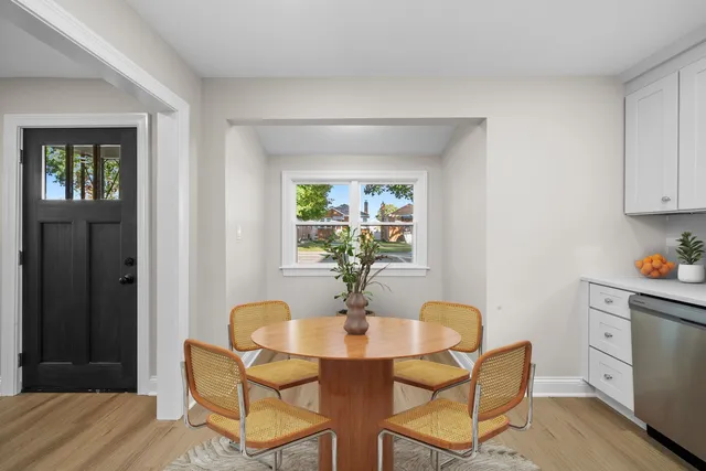 a dining room with furniture and window