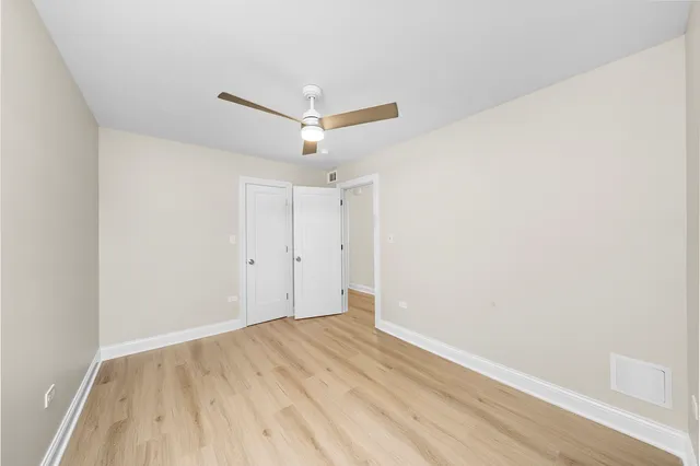 a view of hallway with wooden floor