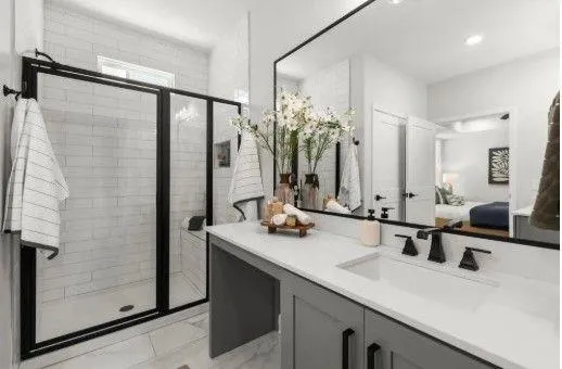 a bathroom with a double vanity sink a mirror and shower