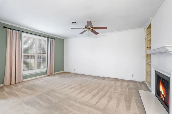 a view of a room with rack on the wall and a chandelier