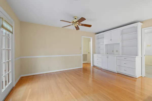 a kitchen with stainless steel appliances cabinets and a window