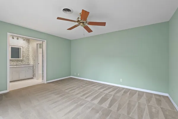 a view of empty room with windows