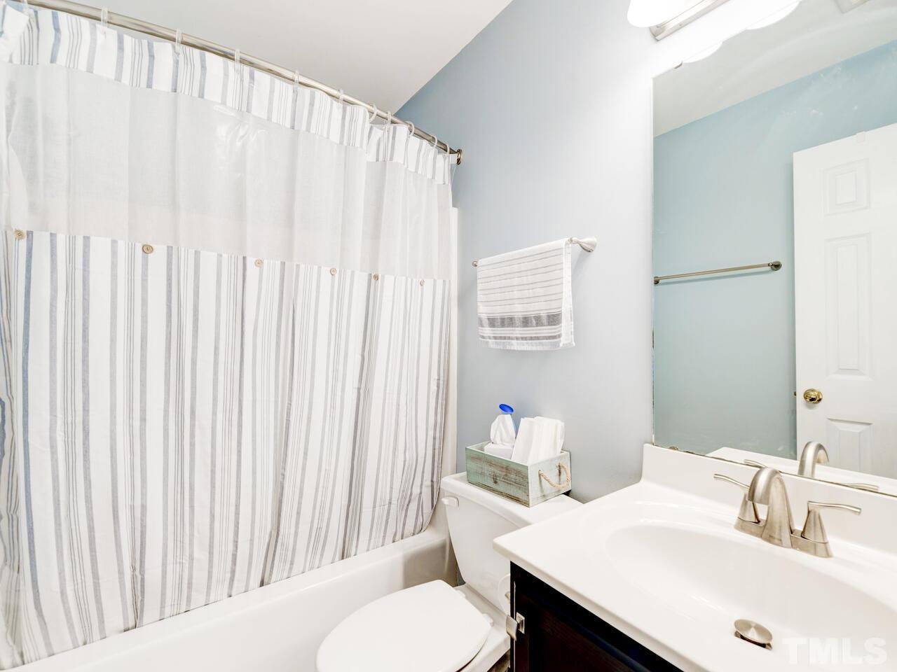 4209 Willow Lake Road Raleigh, NC 27616 - Photo 34 of 54 a bathroom with a sink a toilet and a mirror