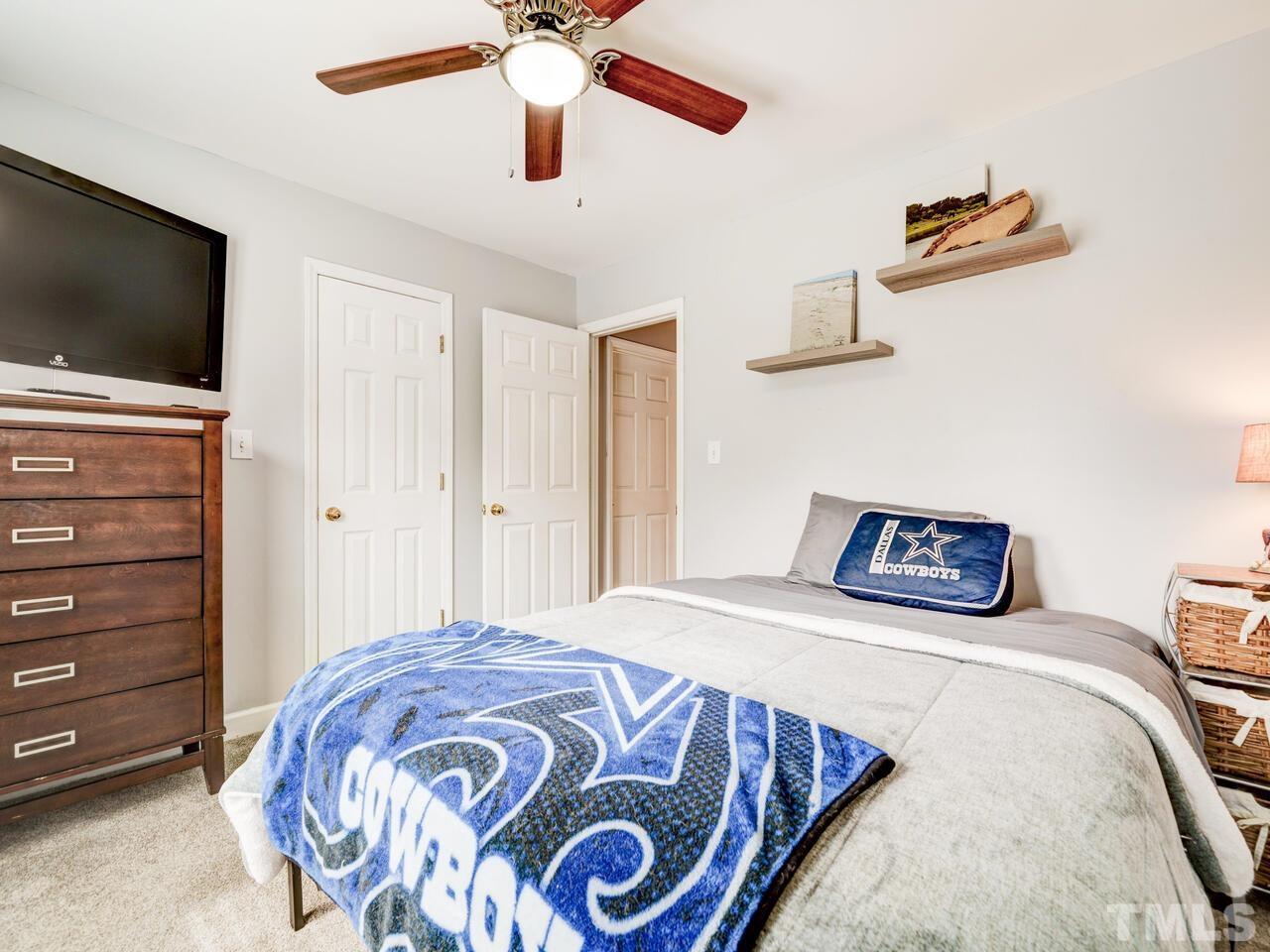 4209 Willow Lake Road Raleigh, NC 27616 - Photo 37 of 54 a bedroom with a bed and a flat screen tv