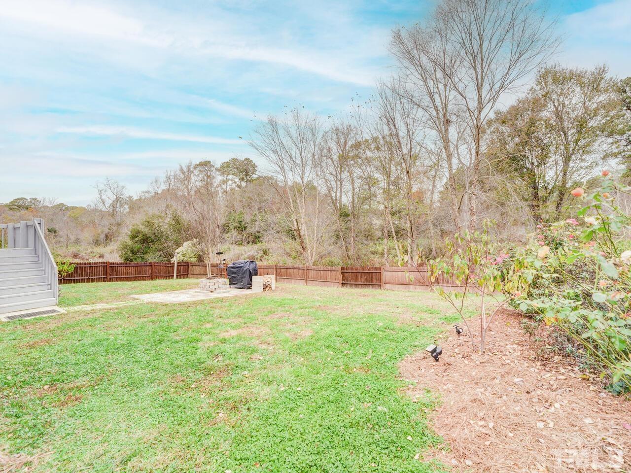 4209 Willow Lake Road Raleigh, NC 27616 - Photo 40 of 54 a view of yard with swimming pool and trees