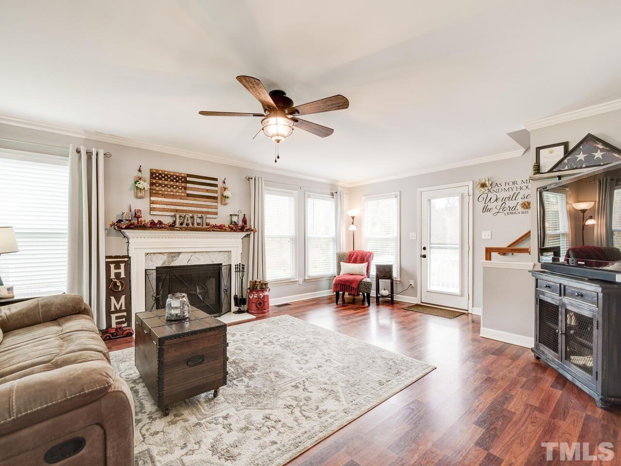 4209 Willow Lake Road Raleigh, NC 27616 - Photo 5 of 54 a living room with furniture and a fireplace