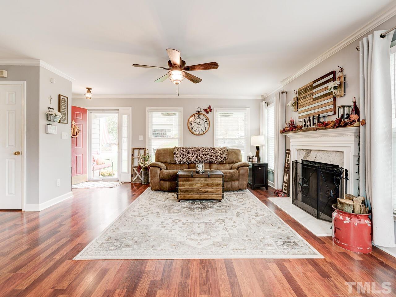 4209 Willow Lake Road Raleigh, NC 27616 - Photo 7 of 54 a living room with furniture and a fireplace