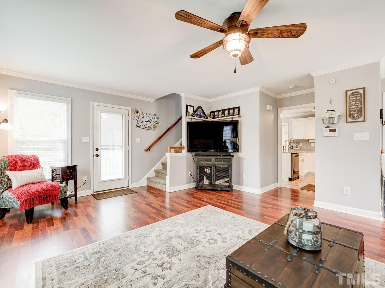 4209 Willow Lake Road Raleigh, NC 27616 - Photo 8 of 54 a living room with furniture and wooden floor