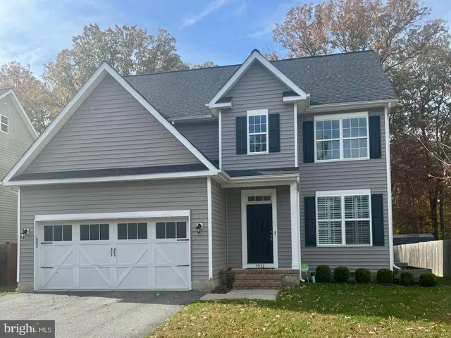 front view of a house and a yard
