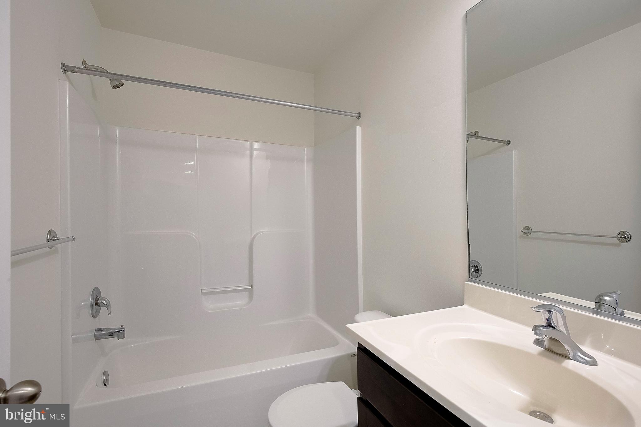 5952 Tyler Road Deale, MD 20751 - Photo 16 of 33 a bathroom with a sink and a mirror