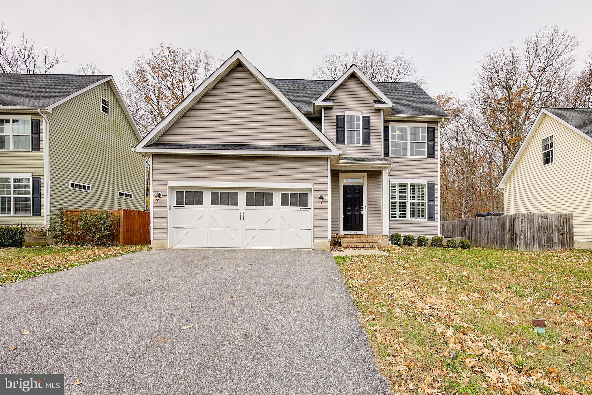 5952 Tyler Road Deale, MD 20751 - Photo 2 of 33 a front view of a house with a yard