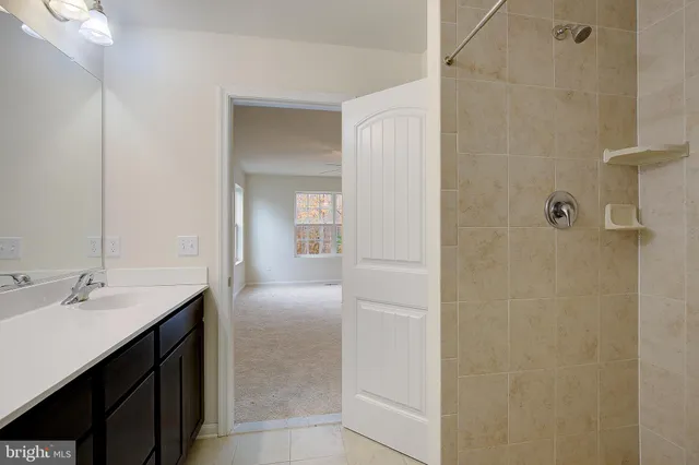 a en suite bathroom with a sink and mirror
