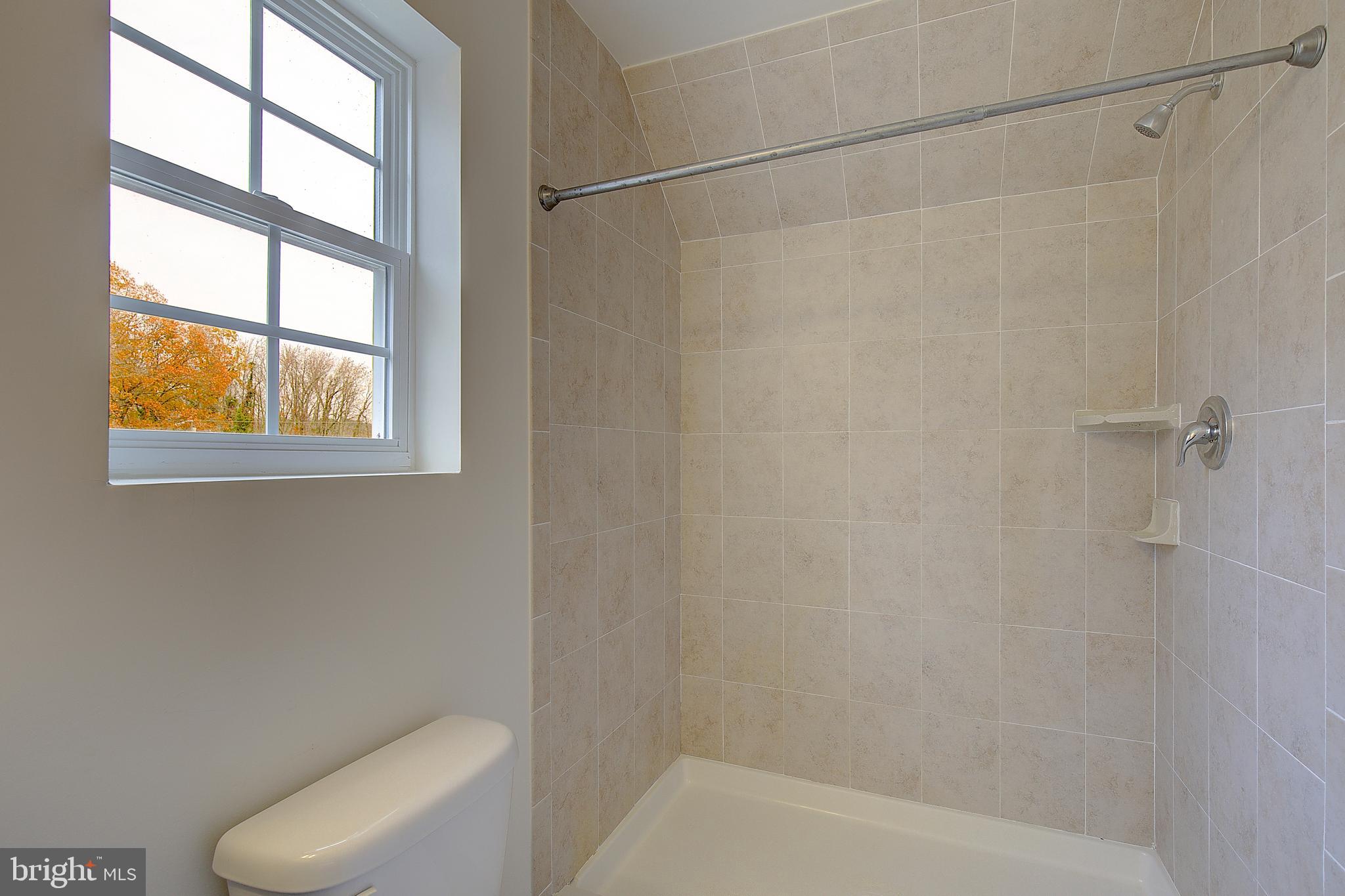 5952 Tyler Road Deale, MD 20751 - Photo 29 of 33 a bathroom with a toilet and a shower