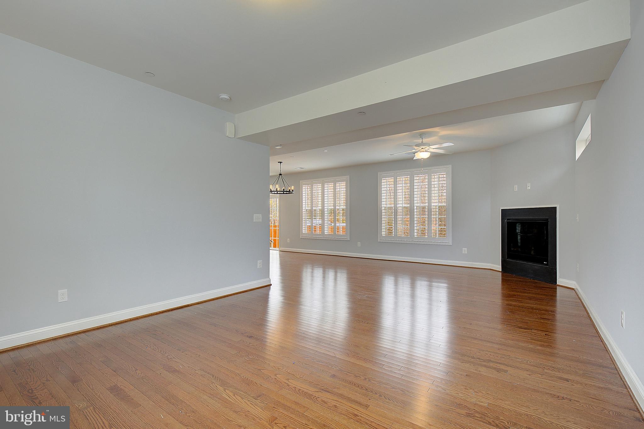 5952 Tyler Road Deale, MD 20751 - Photo 4 of 33 a view of an empty room with wooden floor and a window