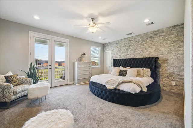 a spacious bathroom with a granite countertop sink a mirror and a bathtub