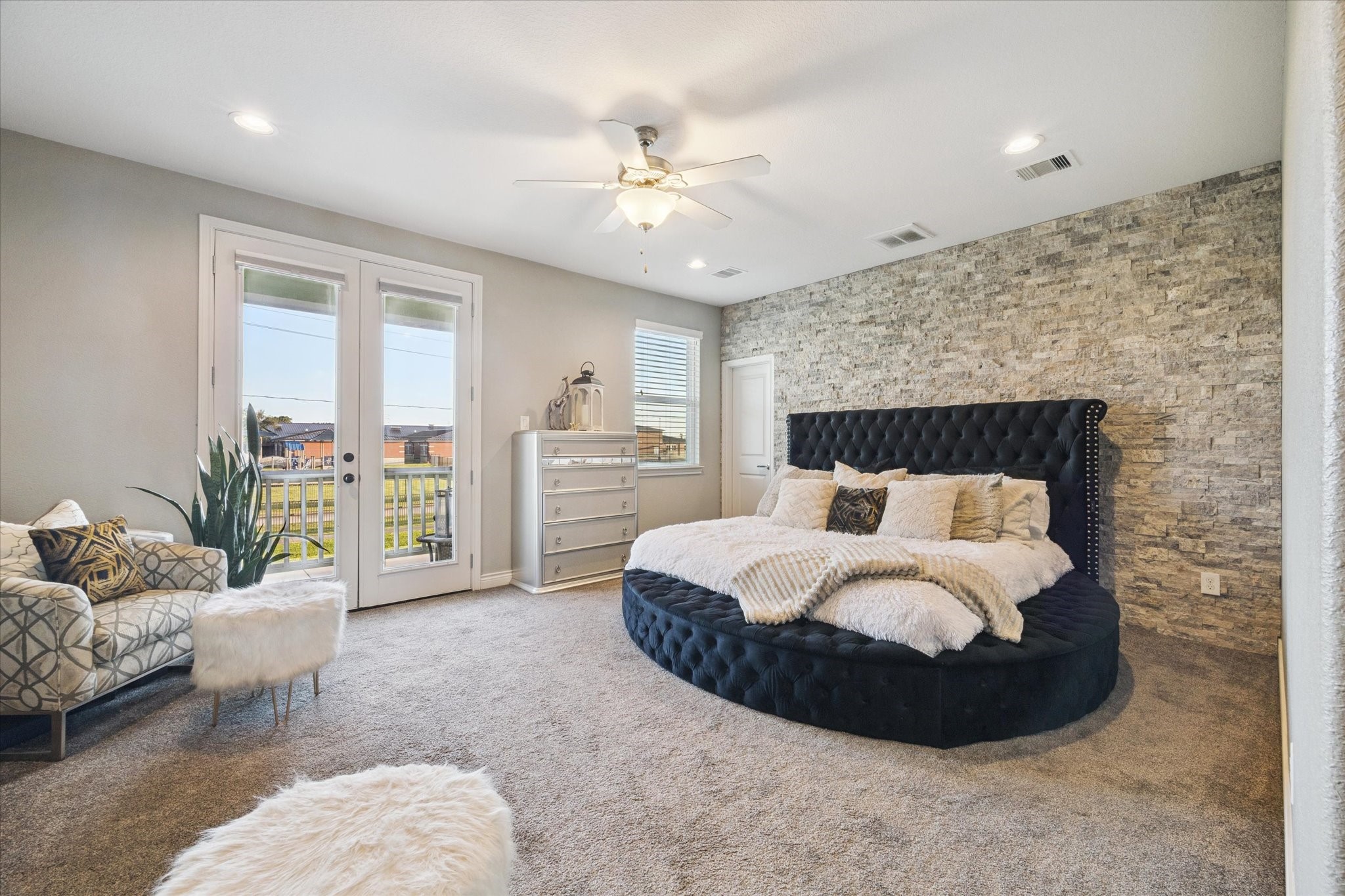 207 West 6th Street Kemah, TX 77565 - Photo 15 of 41 a bedroom with a bed mirror and couch