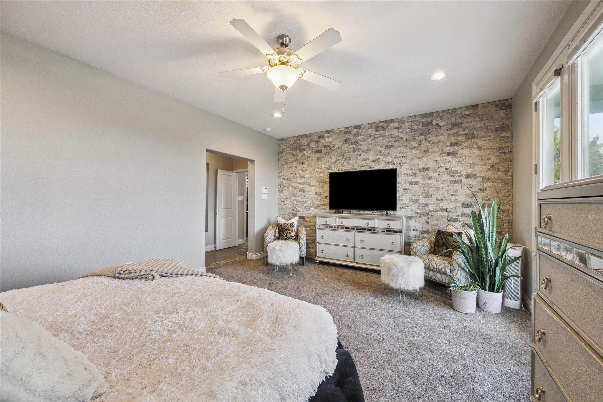 207 West 6th Street Kemah, TX 77565 - Photo 16 of 41 a spacious bedroom with a bed and a flat screen tv