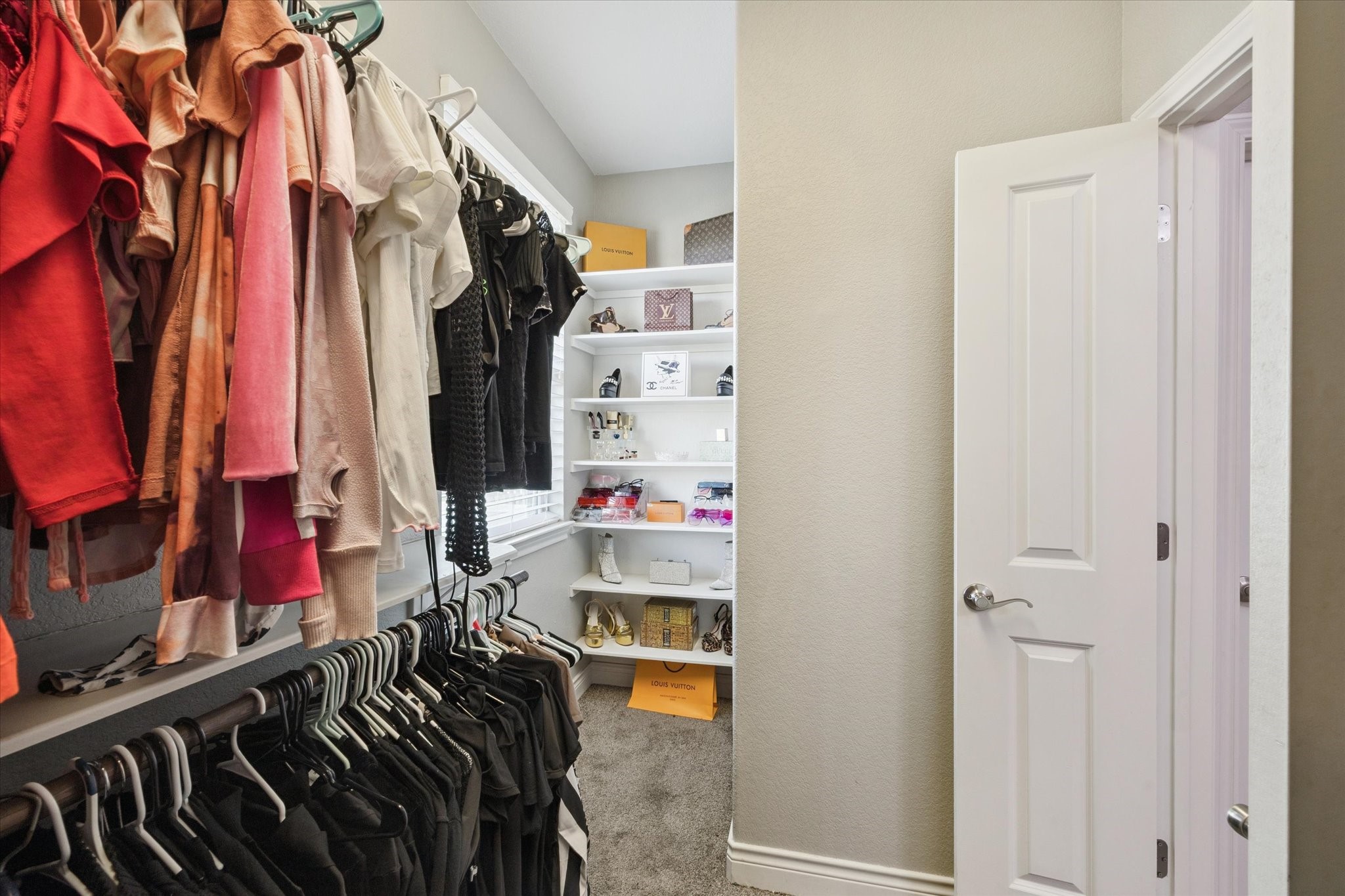 207 West 6th Street Kemah, TX 77565 - Photo 20 of 41 a view of walk in closet with clothes and shoes