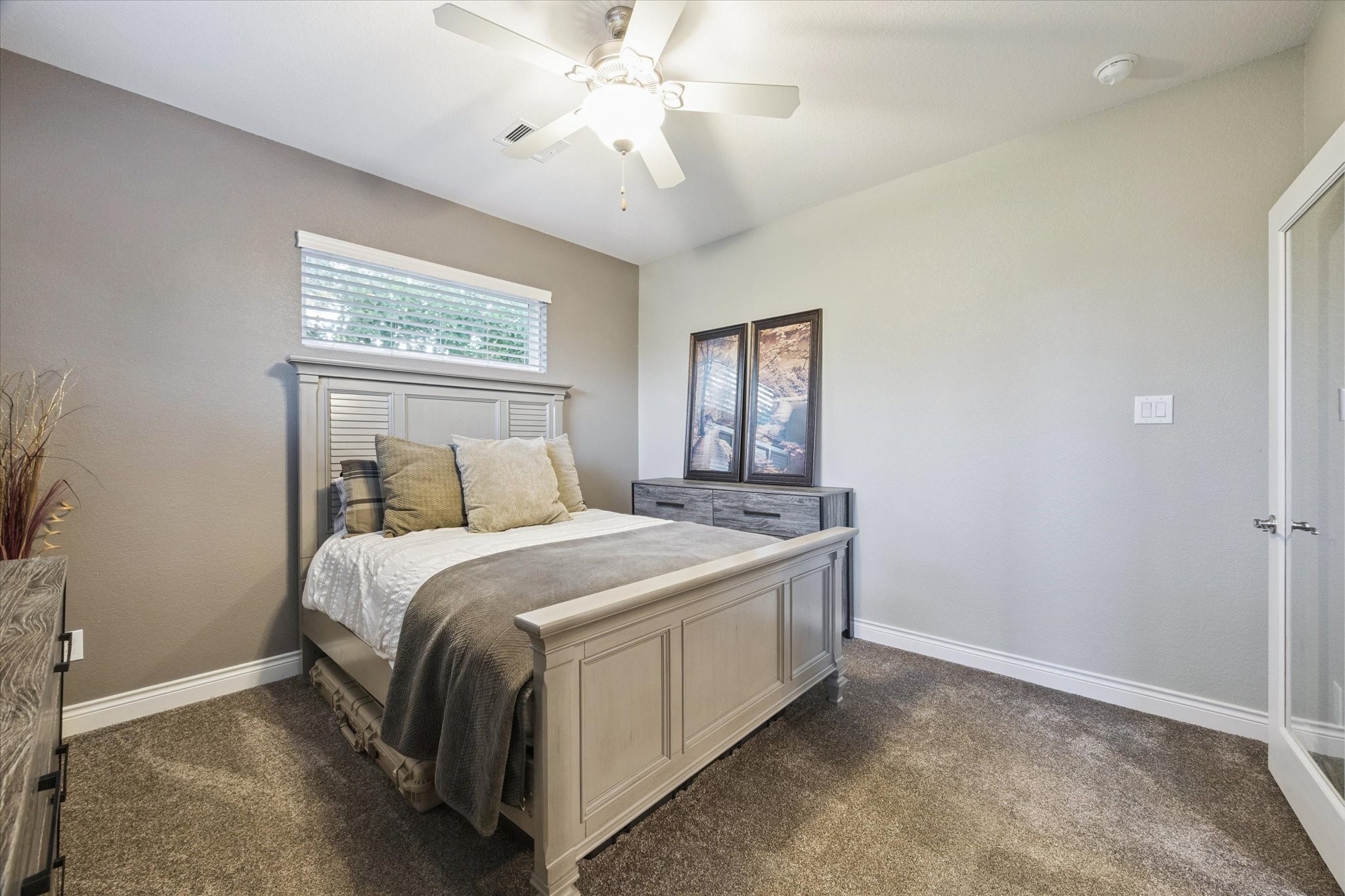 207 West 6th Street Kemah, TX 77565 - Photo 24 of 41 a bed room with a bed and a chandelier