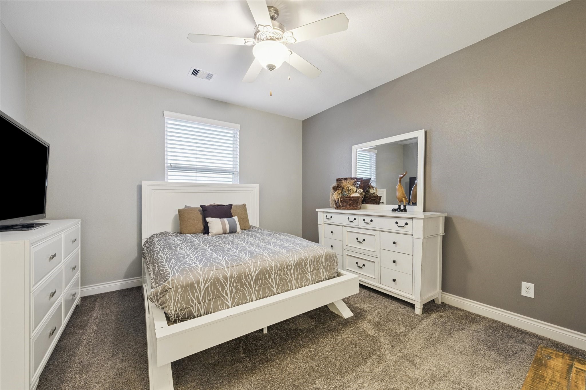 207 West 6th Street Kemah, TX 77565 - Photo 25 of 41 a bedroom with a bed and a flat screen tv