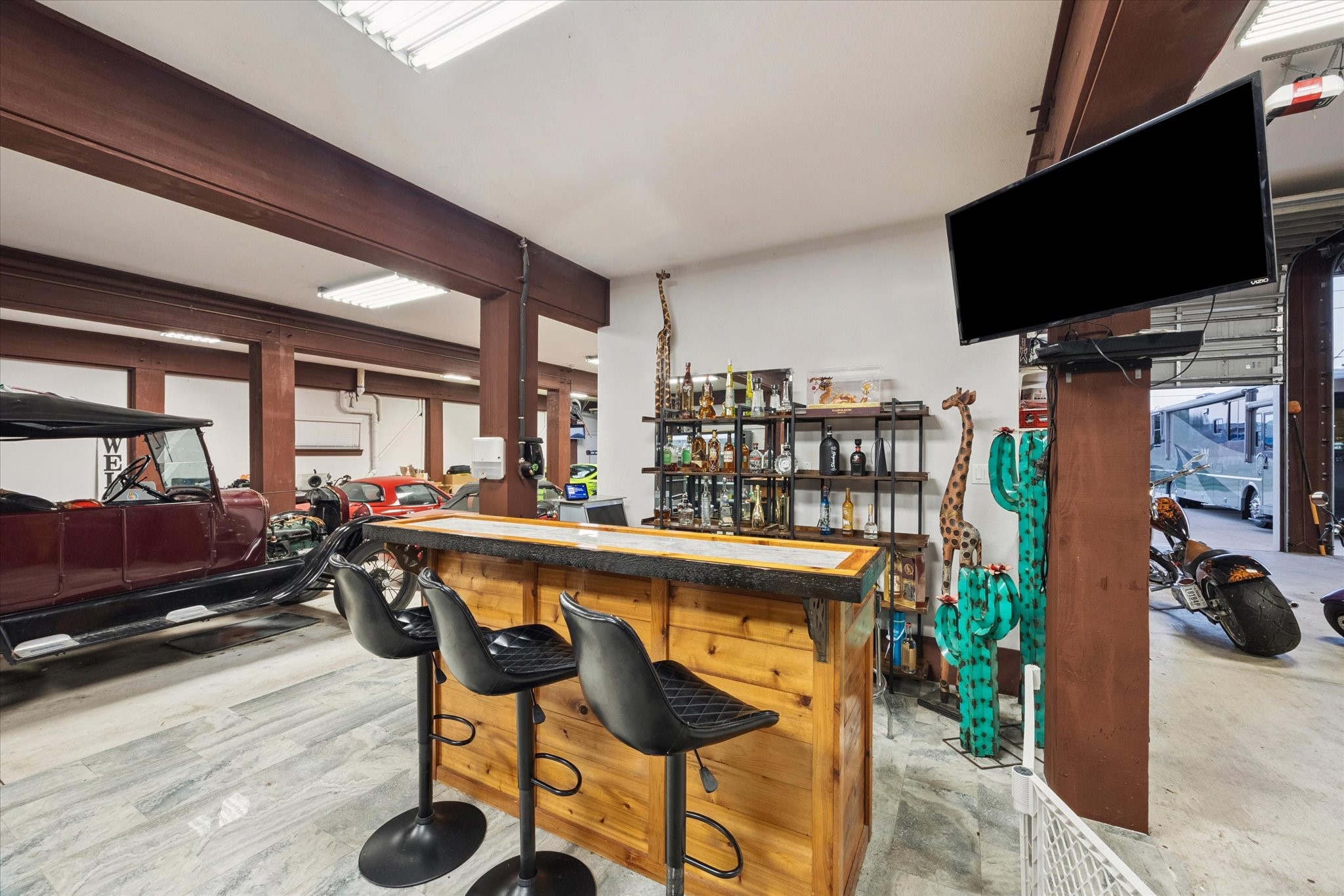207 West 6th Street Kemah, TX 77565 - Photo 31 of 41 a dining room with furniture and a flat screen tv