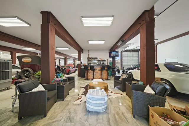 a view of parking garage with cars and other equipment