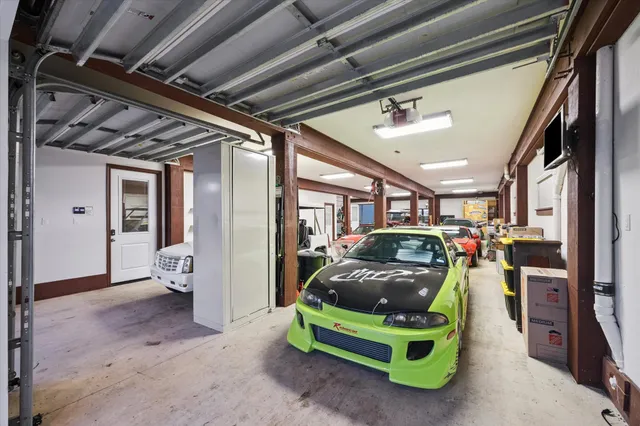 a view of parking garage with cars
