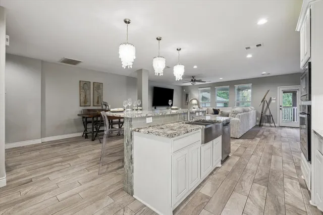 a kitchen with granite countertop white cabinets and a granite counter tops