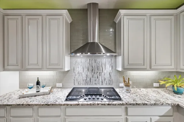 a living room with furniture and a view of kitchen