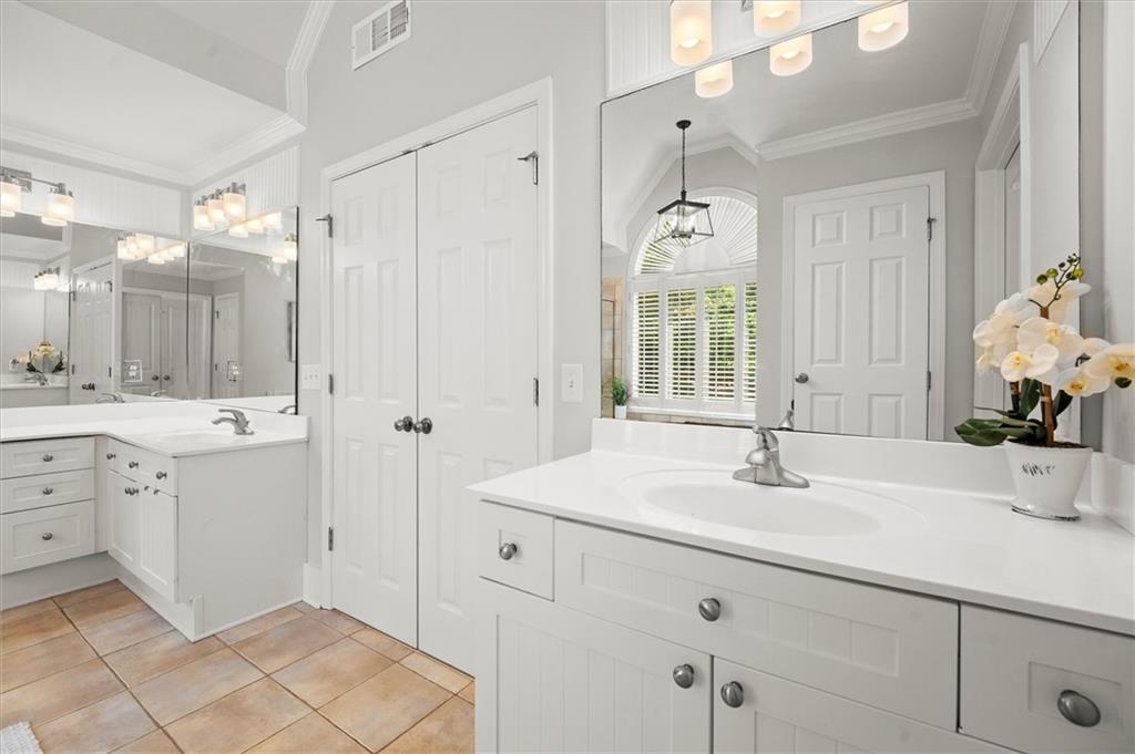 6229 Grand Loop Road Sugar Hill, GA 30518 - Photo 45 of 93 a bathroom with a sink and a mirror