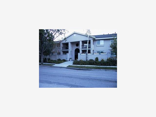 a picture of a bench in front of a house