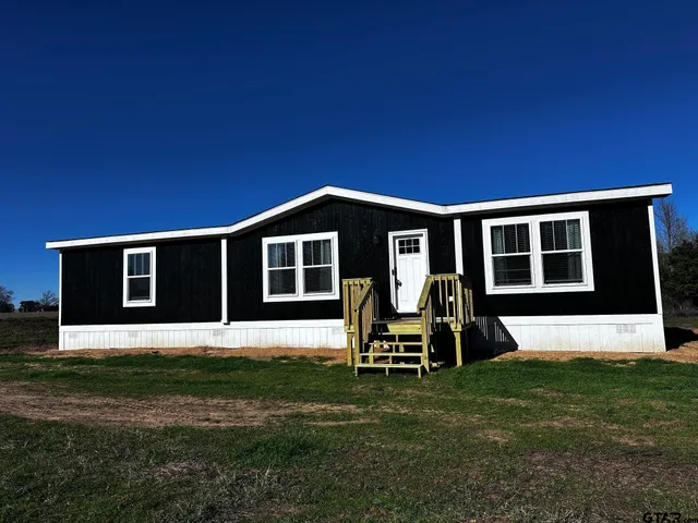 a house view with a garden space
