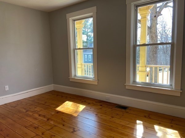 33 Ash Street Spencer, MA 01562 - Photo 11 of 37 a view of empty room with wooden floor and fan