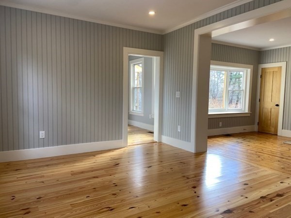 33 Ash Street Spencer, MA 01562 - Photo 15 of 37 an empty room with wooden floor and windows