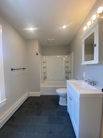 33 Ash Street Spencer, MA 01562 - Photo 25 of 37 a bathroom with a sink a toilet and shower
