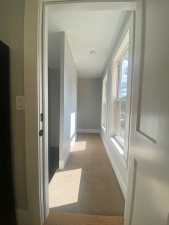33 Ash Street Spencer, MA 01562 - Photo 27 of 37 a view of a hallway with windows