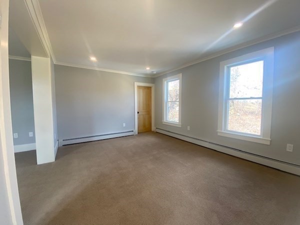 33 Ash Street Spencer, MA 01562 - Photo 28 of 37 an empty room with a empty space and windows