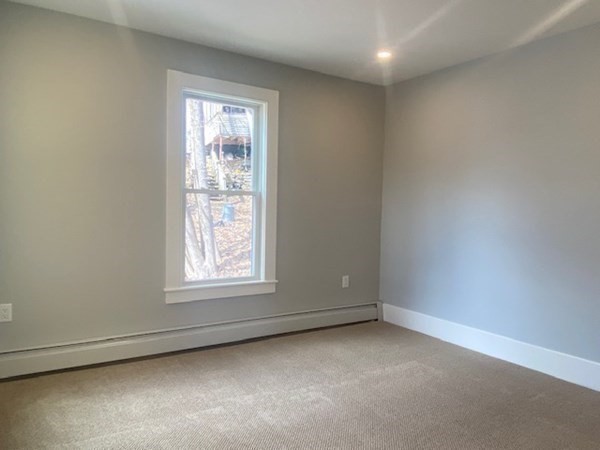 33 Ash Street Spencer, MA 01562 - Photo 30 of 37 an empty room with a window