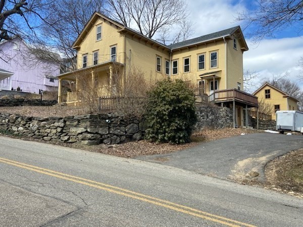 33 Ash Street Spencer, MA 01562 - Photo 3 of 37 a view of a house with a street