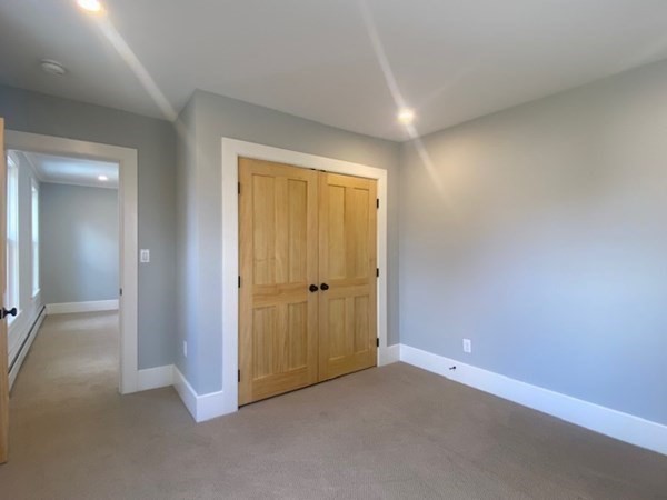 33 Ash Street Spencer, MA 01562 - Photo 31 of 37 an empty room with closet and a bathroom