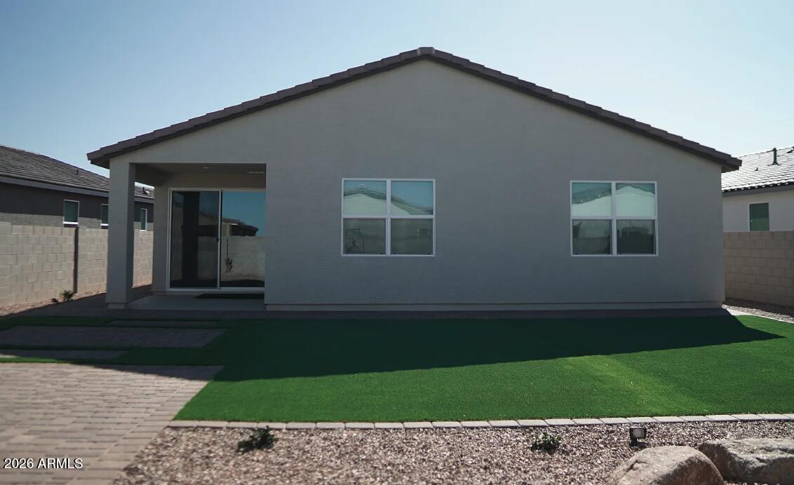 2426 Grenache Road San Tan Valley, AZ 85143 - Photo 13 of 29 a backyard of a house with lots of green space