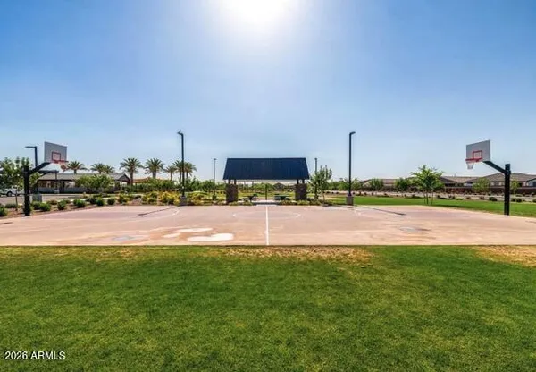 a view of a fountain in front of a big building