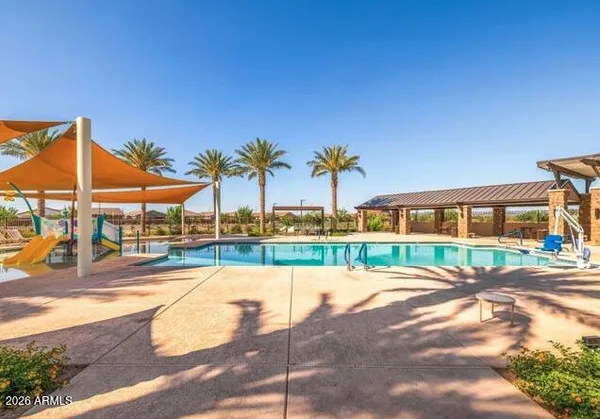 a view of a swimming pool with a lounge chair