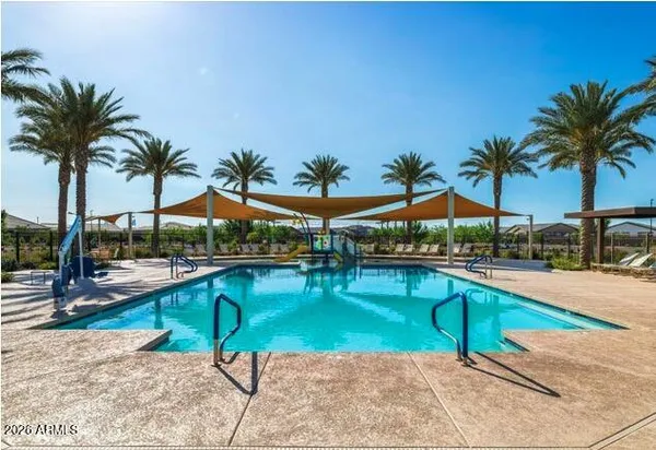 a view of swimming pool with chairs