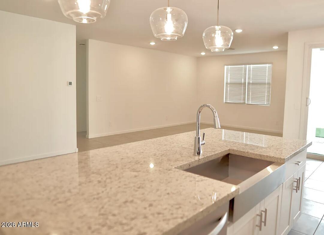2426 Grenache Road San Tan Valley, AZ 85143 - Photo 2 of 29 a bathroom with a sink and a mirror