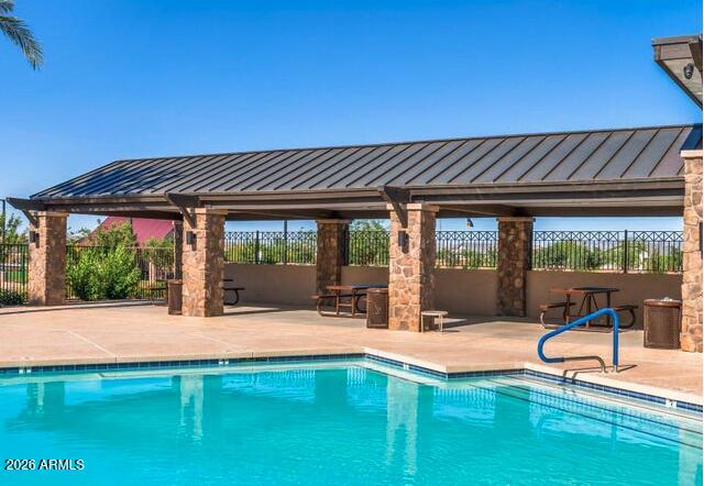 2426 Grenache Road San Tan Valley, AZ 85143 - Photo 21 of 29 a swimming pool with outdoor seating and yard