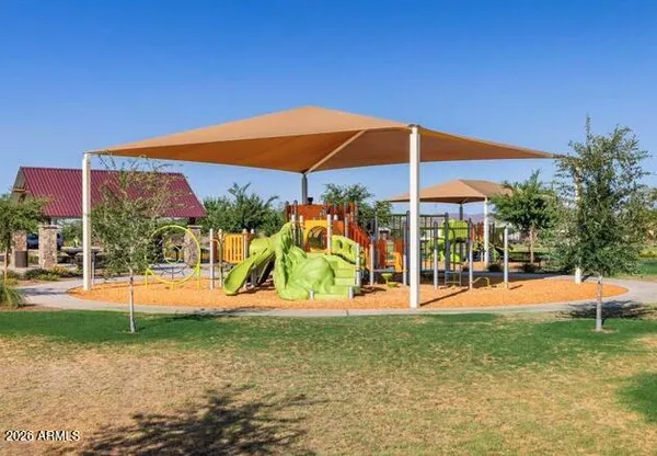 a view of a playground with basketball court