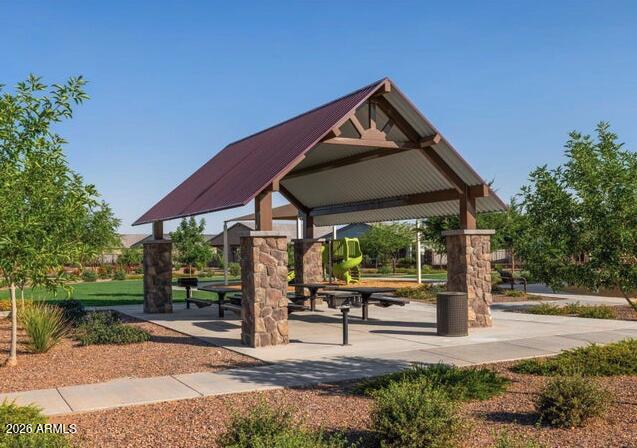 2426 Grenache Road San Tan Valley, AZ 85143 - Photo 26 of 29 a front view of a house with garden
