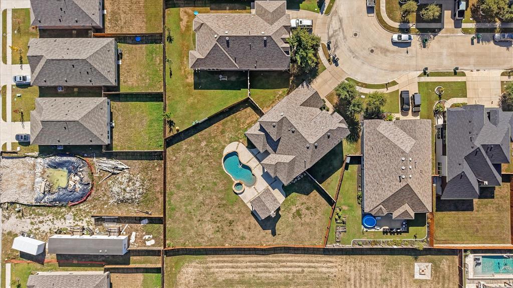 2044 Longbridge Road Forney, TX 75126 - Photo 36 of 40 Fenced backyard with an in-ground swimming pool and adjacent hot tub