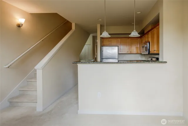 a view of entryway and kitchen